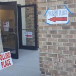 Outside a polling place in Delaware where signs direct voters to the voting booths