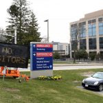 A sign at the entrance of UMass Memorial Medical Center - University Campus in Worcester, Mass. indicates that there are no visitors permitted during the COVID-19 crisis.