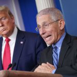 Anthony Fauci of the White House Coronavirus Task Force answers questions during a press conference as Donald Trump watches.