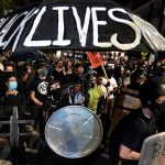 Protestors march in Rochester, New York in response to the police killing of Daniel Prude