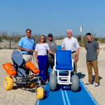 Sen. Ernie Lopez, Lewes Mayor Ted Becker and Deputy Mayor Andrew Williams joins Mason's Mobility Mission to celebrate the beach mat at Roosevelt Inlet.