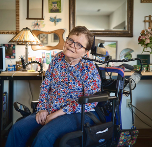 Martha Chambers, seen here at her home in Milwaukee, Wis., is seated in a motorized wheelchair