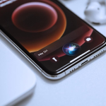 An iPhone sitting on a table