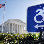 Neoclassical facade of the Supreme Court Building with its columns and pediment frieze. Accessible parking sign. U.S. flag.
