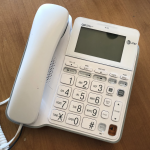 A wired telephone with large buttons.