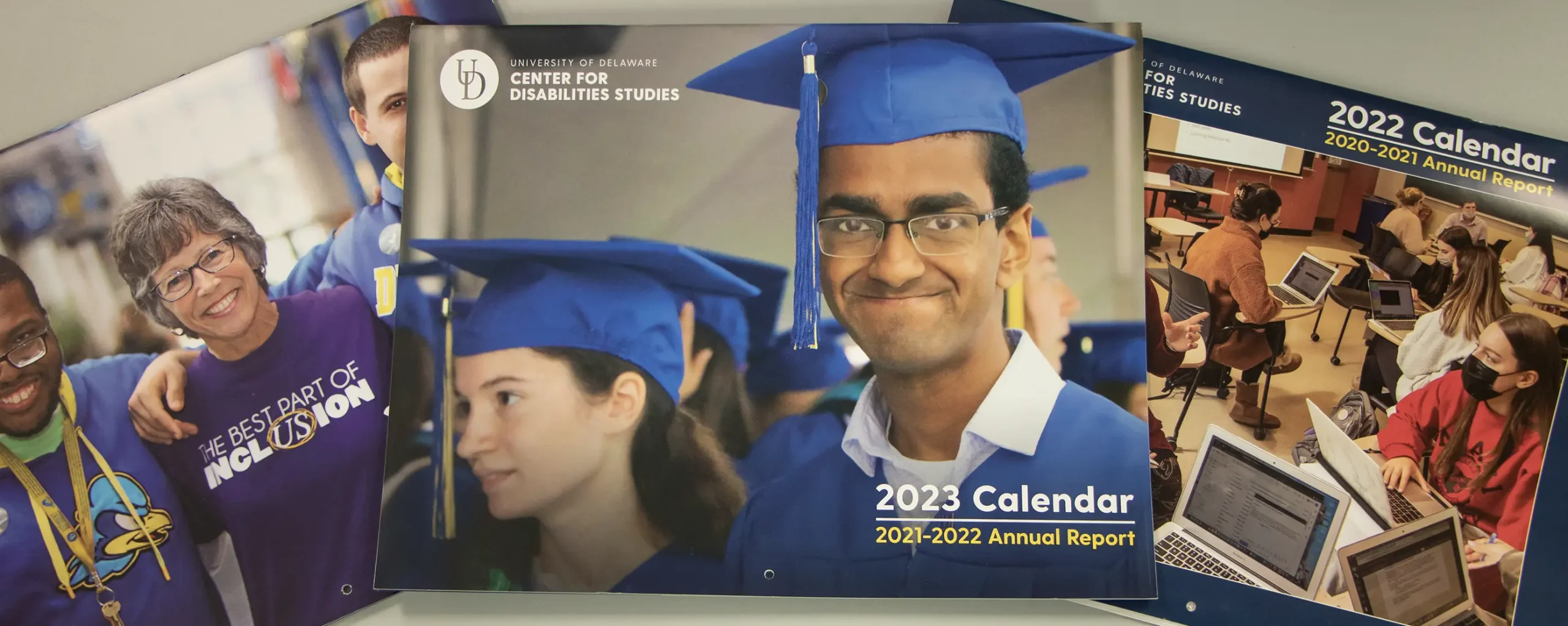 The 2021, 2022 and 2023 CDS annual report calendars on a desktop.