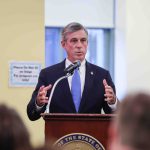 Governor Carney speaking at a podium