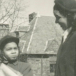 A vintage black and white image of a woman and child.