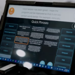 A touchscreen tablet with digital buttons for voice banking software