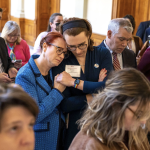 People gather and support one another at the Georgia state Senate in Atlanta