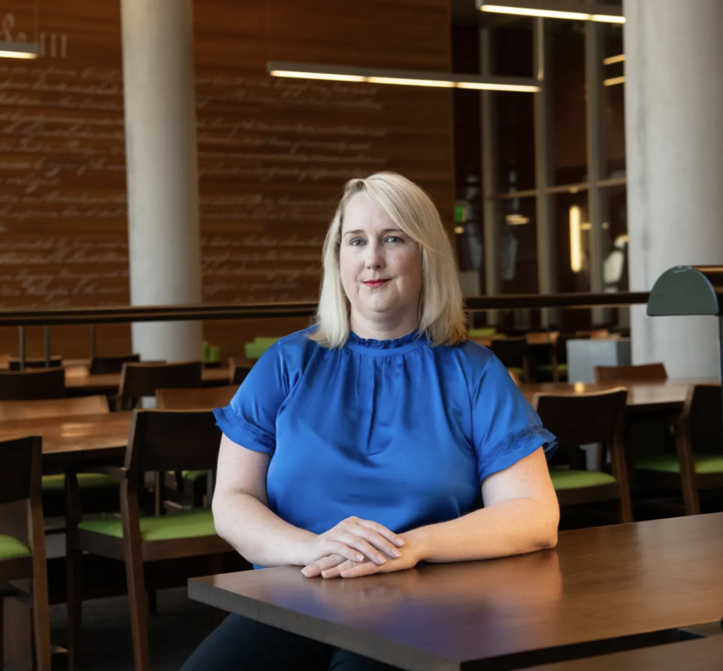 Katherine Macfarlane in the library at Syracuse University College of Law