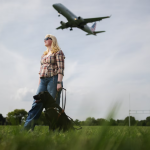 Elizabeth Schoen with her black Labrador service dog, Eva, at Gravelly Point Park near Reagan National Airport in Arlington, Virginia