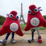 The mascots of the Paris 2024 Olympic and Paralympic Games pose next to the Eiffel Tower in Paris