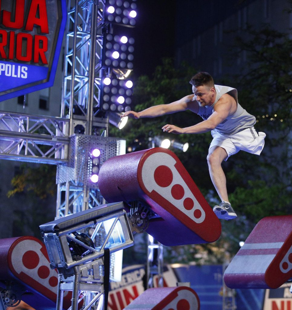 Zach Gowen, who is an amputee, jumps an obstacle on Ninja Warrior