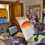 Students with disabilities often use adaptive devices to support their artistic work. Here, a student uses an adaptive tool during an ArtFest event. During the Center for Disabilities Studies’ training, visual and performing arts teachers learned how to support students with tools like this one and in other ways.
